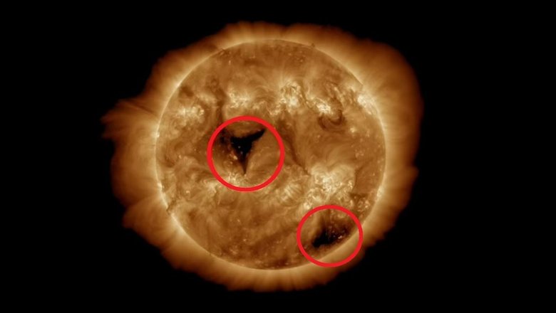 Солнечные пятна в атмосфере Солнца (выделены красным)