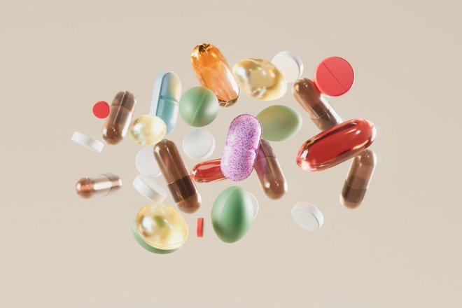 a-group-of-pills-floating-in-the-air