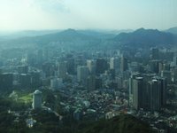 Content image for: 478899 | Вид на Сеул с Башни N - на стеклах написано, сколько километров от этой башни до разных городов мира