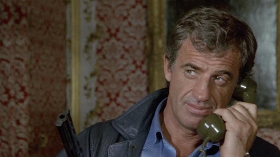 Жан-Поль Бельмондо в фильме «Профессионал» Жан-Поль Бельмондо в фильме «Профессионал»