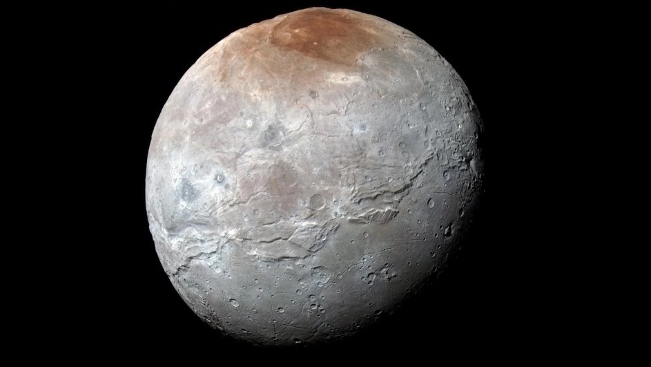 Это Харон, один из спутников Плутона. Его диаметр в два раза меньше диаметра карликовой планеты.