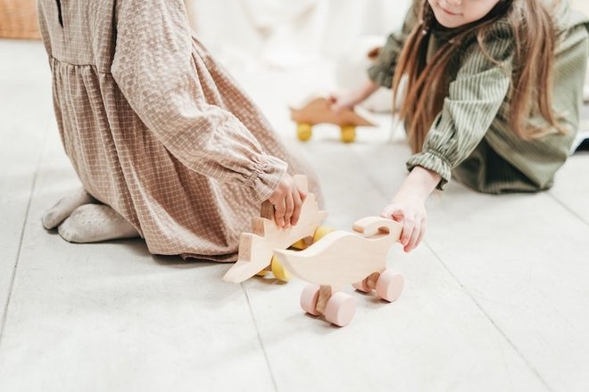 photo-of-two-girls-playing-with-wooden-toys-3662821.jpg