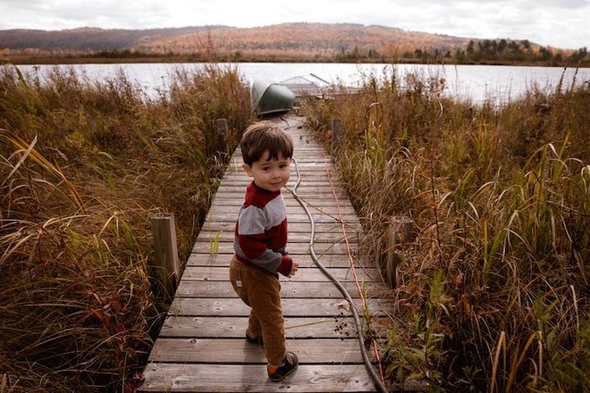 photo-of-boy-standing-on-boardwalk-3204075.jpg