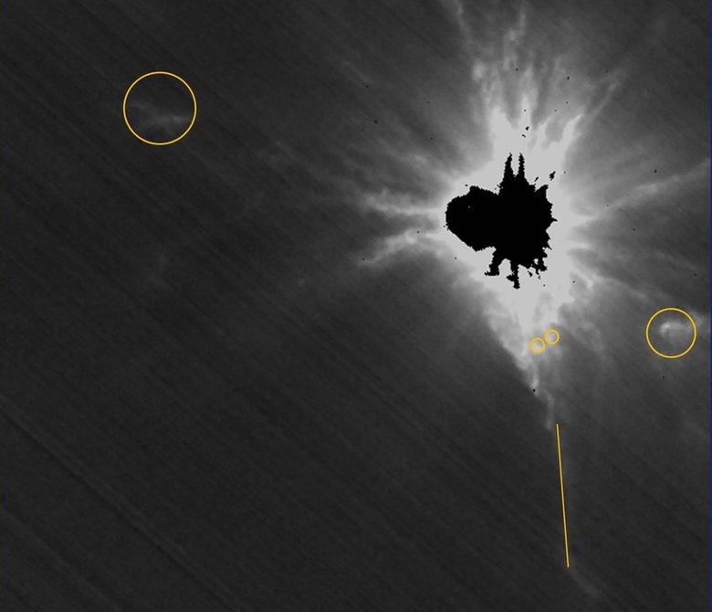 Фото LICIACube сделаны после столкновения зонда и астероида. Кругами отмечены самые значительные выбросы пыли и обломков. Фото: NASA