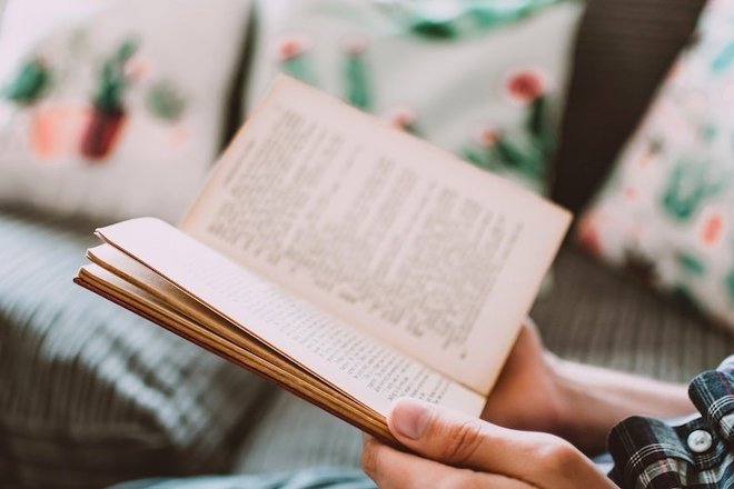 close-up-photo-of-person-holding-book-1485114.jpg