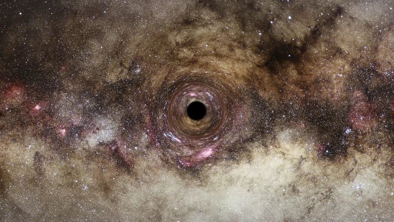Представление художника о черной дыре, искривляющей вокруг себя пространство-время. Астрономы использовали это явление, называемое гравитационным линзированием, для изучения одной из самых больших черных дыр, когда-либо обнаруженных во Вселенной. Фото: ESA/Hubble, Digitized Sky Survey, Nick Risinger 