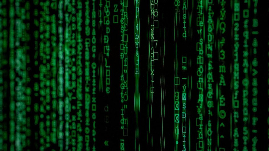На темном фоне нарисованы цифры зеленого цвета На темном фоне нарисованы цифры зеленого цвета