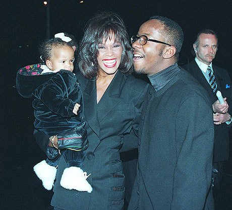 С мужем Бобби Брауном и дочерью Кристиной, 1994 год