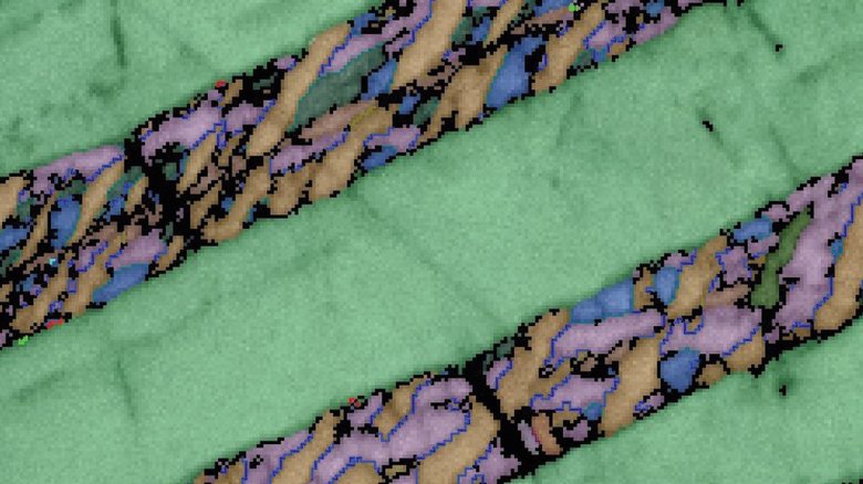 Кристаллы монацита под микроскопом. Фото: phys.org / Университет Кертина
