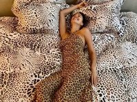 Content image for: 518268 | Ирина Шейк в леопардовом платье позирует на простынях с «кошачьим» принтом