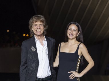Мик Джаггер с девушкой Мелани Мик Джаггер с девушкой Мелани